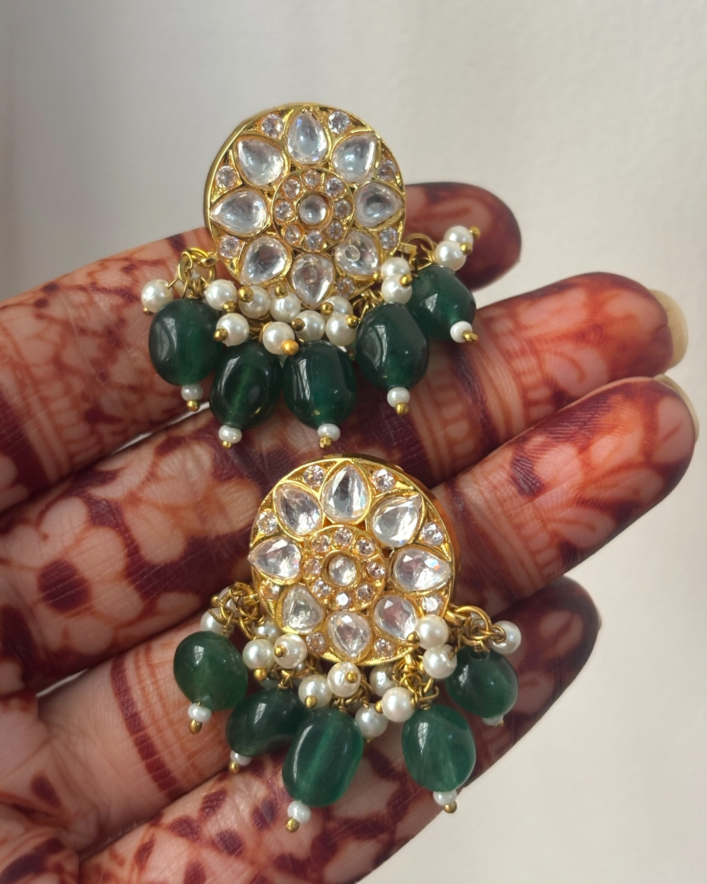 Suman kundan studs with green drops