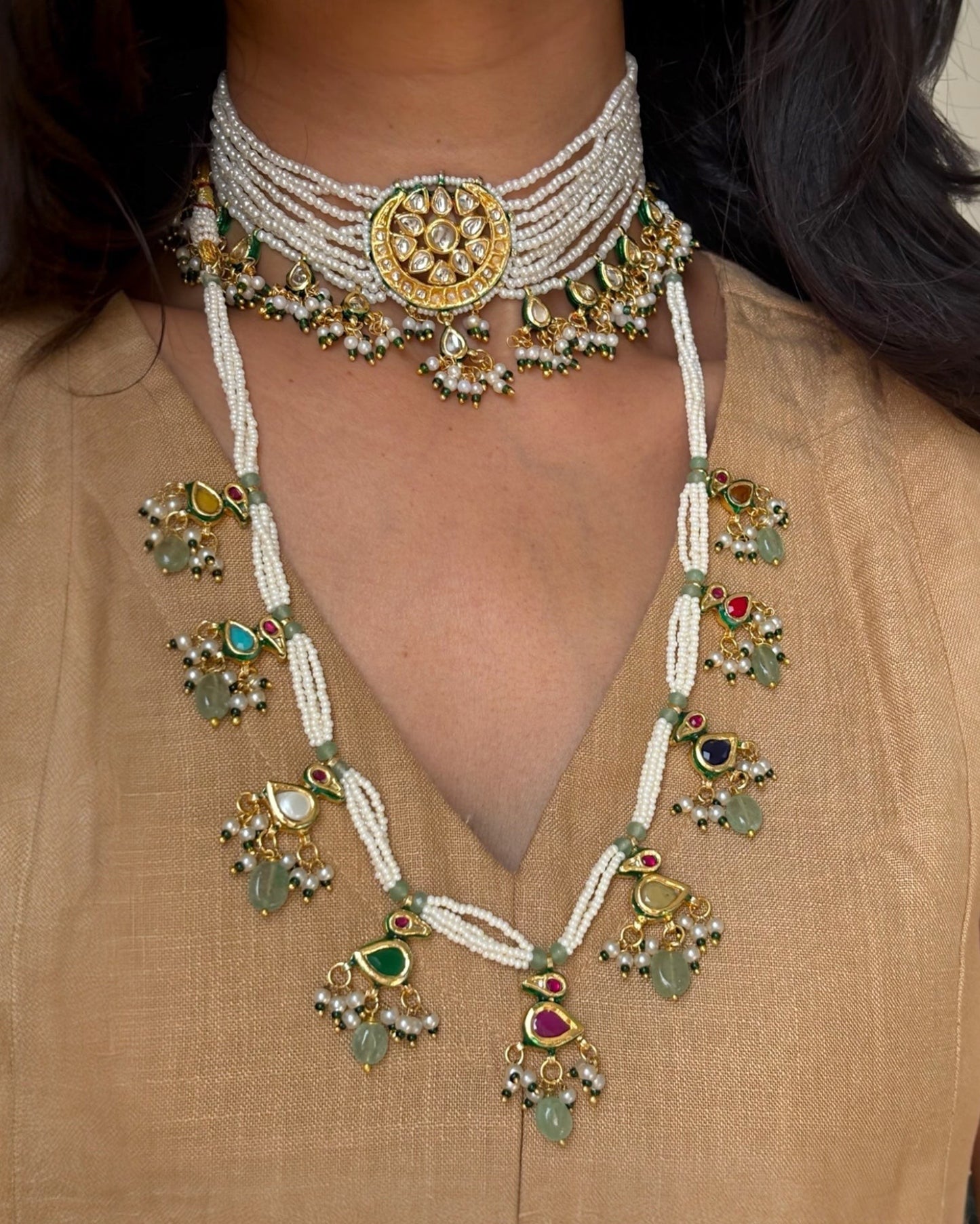 Saanjh Jewels Padmini Pearl Choker Necklace Set with matching earrings, featuring gold-toned detailing, stones, and pearl strands.