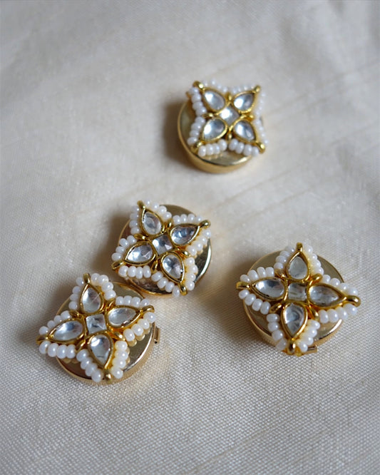 Four-petal floral button clips