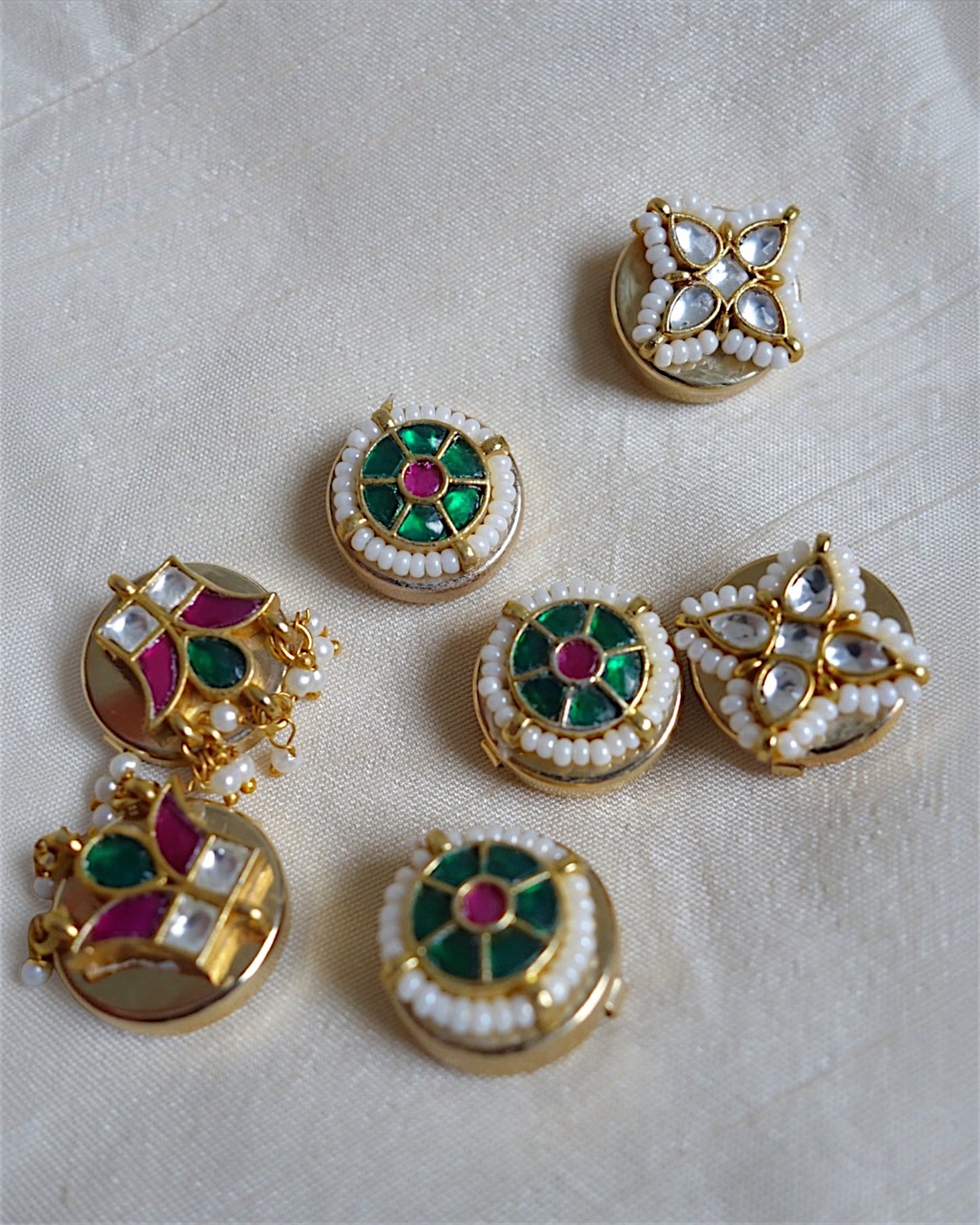 Four-petal floral button clips